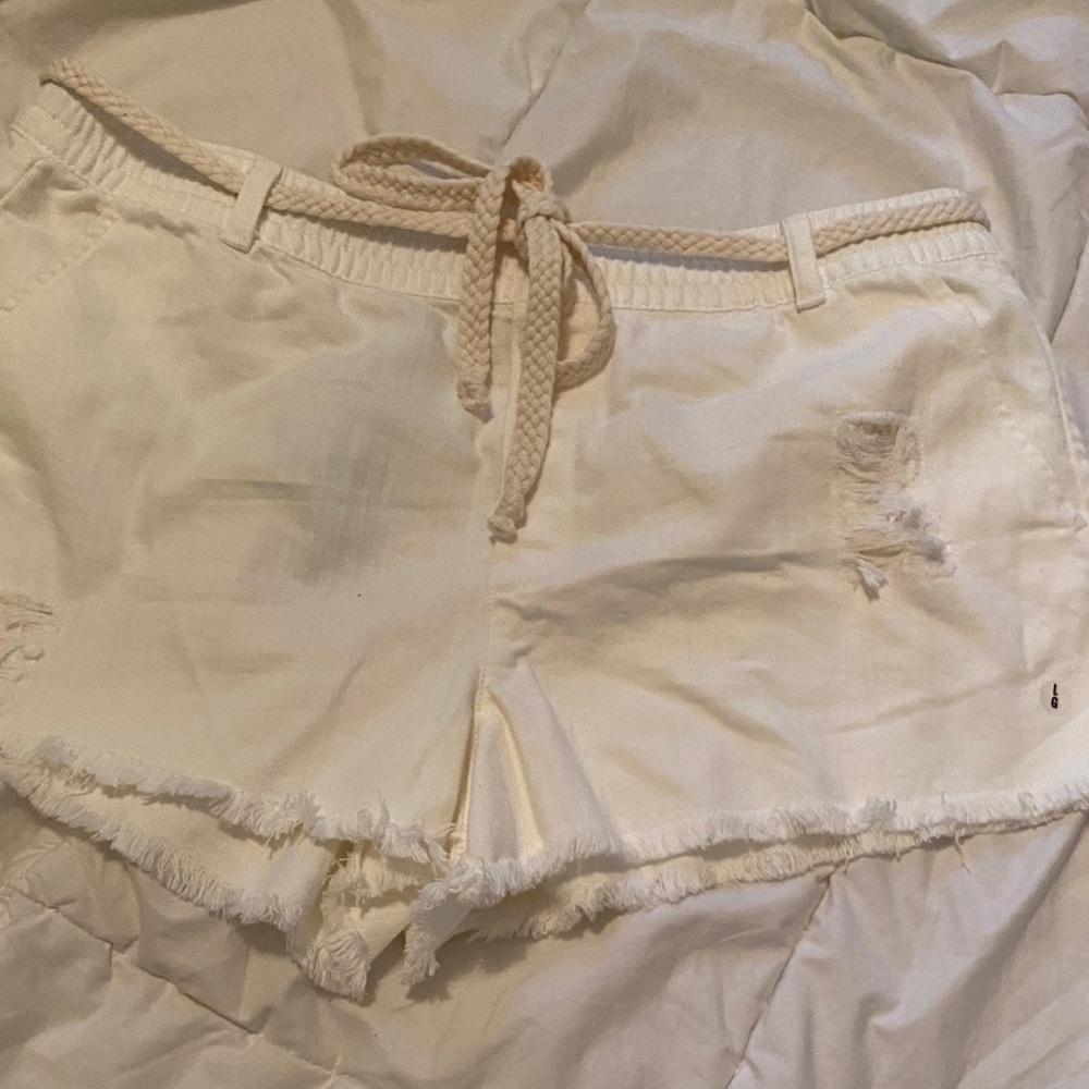 White linen shorts with belt